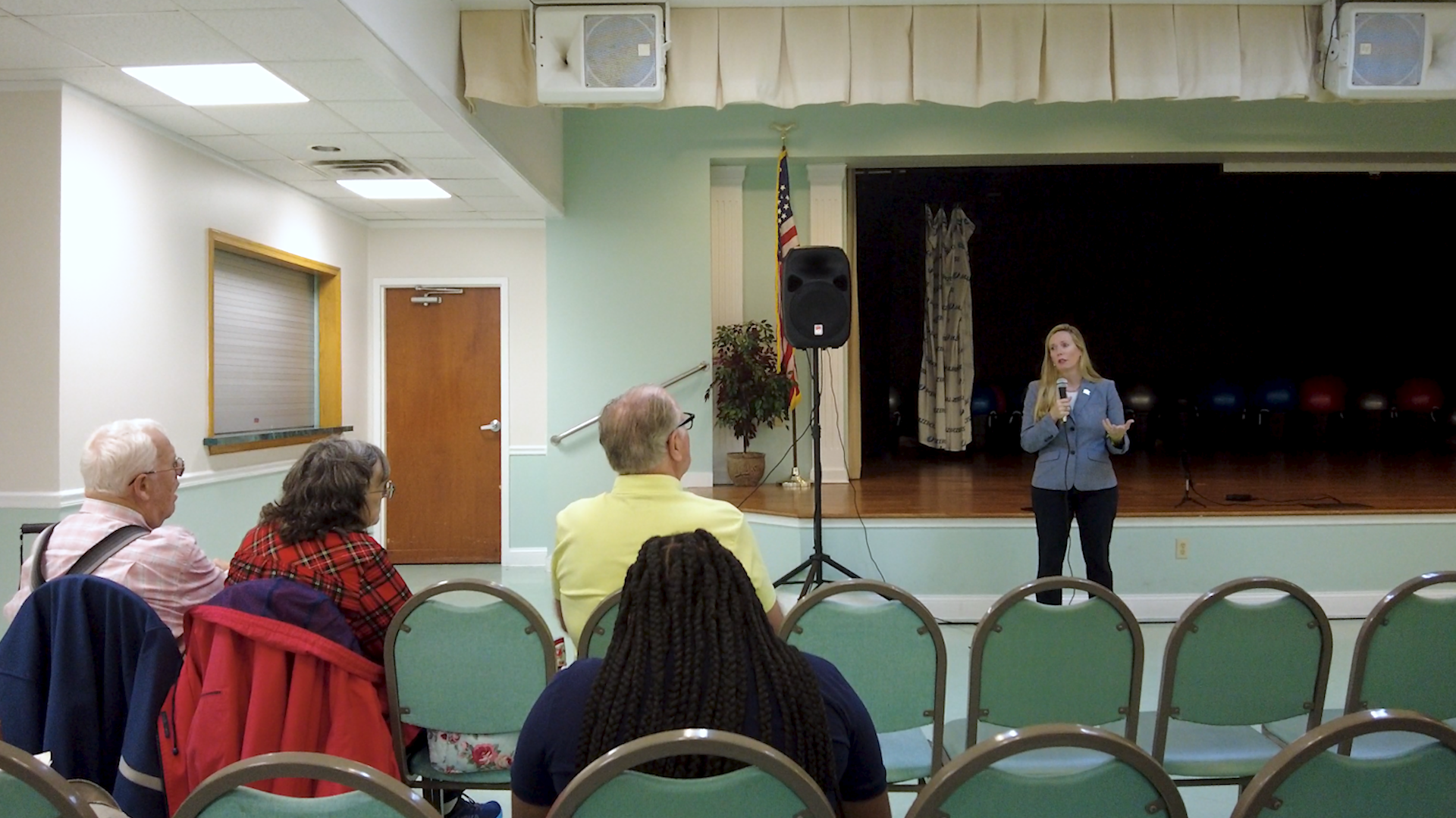Davis speaking at meeting
